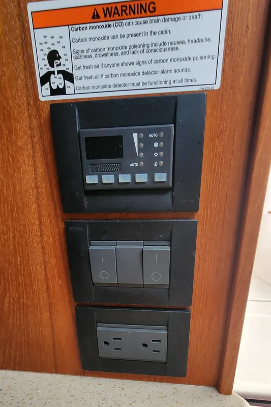 Control panel on 2012 Tiara Yachts 3100 Coronet with carbon monoxide warning sign.