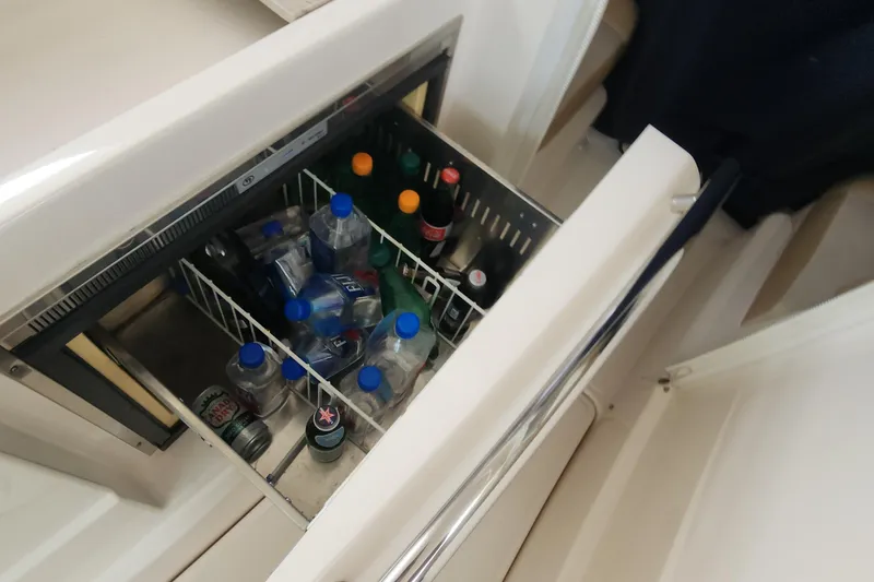 Mini fridge stocked with drinks on a 2012 Tiara Yachts 3100 Coronet.
