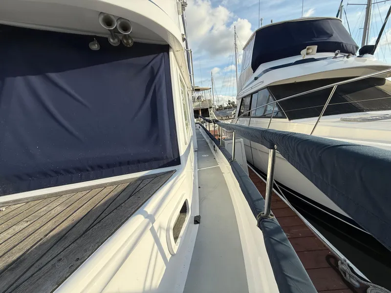 Side view of a 1978 C & L 37 yacht docked at a marina.