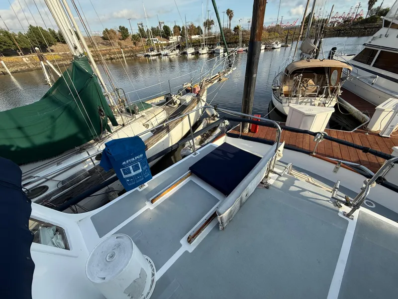 1978 C & L 37 sailboat docked at marina with other boats nearby.