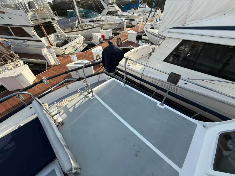 1978 C & L 37 yacht docked among other boats at a marina.