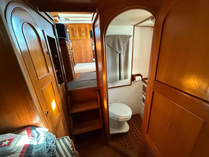 1978 C & L 37 yacht interior with wooden cabinetry and compact bathroom.