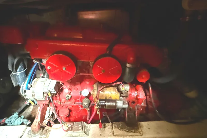 Red engine of a 1978 C & L 37 boat, detailed view.