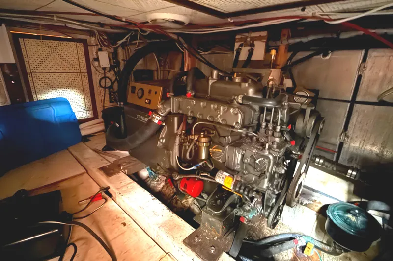 Engine room of a 1978 C & L 37 boat, featuring mechanical components and control panel.