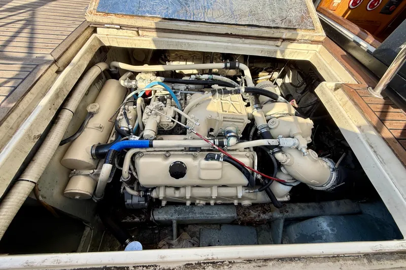 Engine compartment of a 1990 Mikelson 42 boat, showcasing detailed mechanical components.