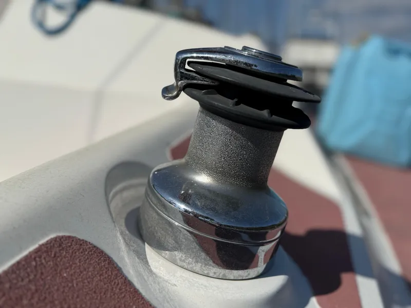 Close-up of a winch on a 1989 Hunter 30 sailboat deck.