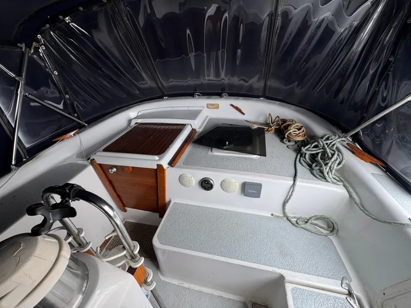 Interior view of 1981 Morgan 416 Out Island sailboat cockpit with ropes and equipment.