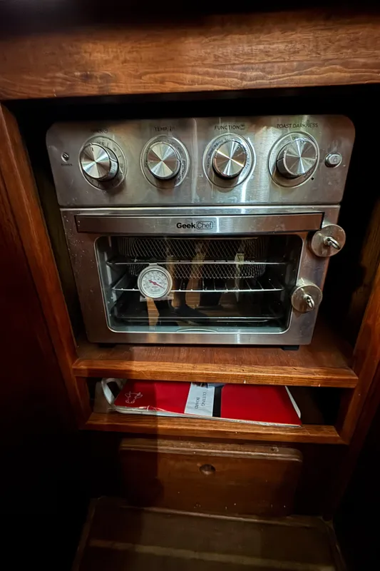 Toaster oven inside 1981 Morgan 416 Out Island yacht kitchen cabinet.