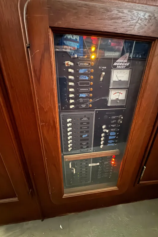 Electrical panel inside a 1981 Morgan 416 Out Island yacht, featuring switches and meters.