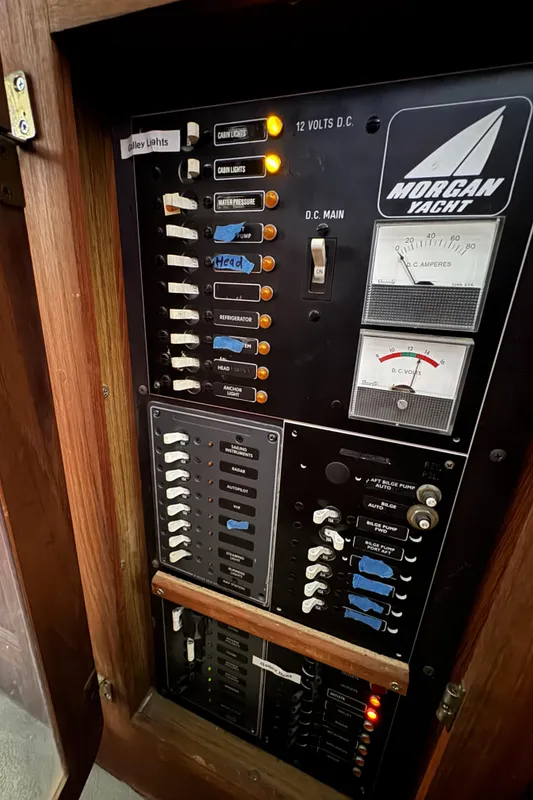 Electrical panel of a 1981 Morgan 416 Out Island yacht with labeled switches and gauges.