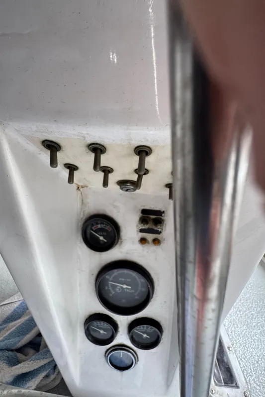 Control panel of a 1981 Morgan 416 Out Island sailboat with gauges and switches.