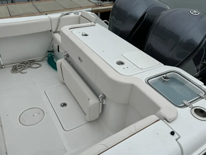 2021 Sea Hunt Gamefish 30 Coffin Box boat interior with dual engines and seating area.