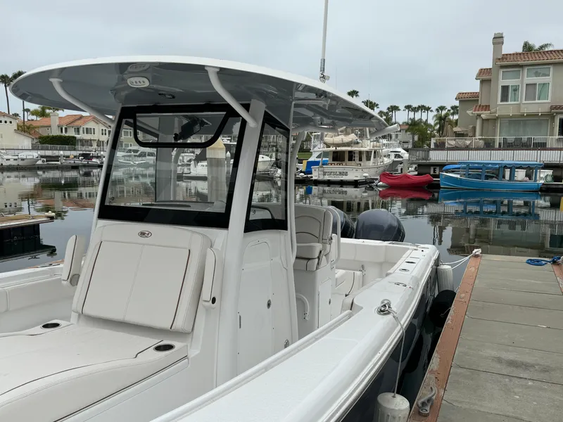 2021 Sea Hunt Gamefish 30 Coffin Box boat docked in a marina.