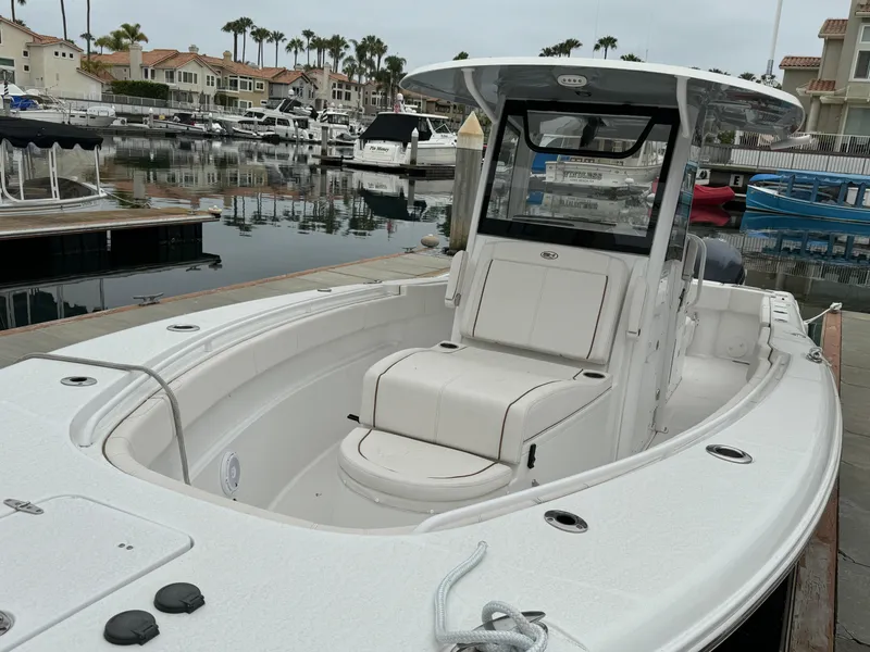 2021 Sea Hunt Gamefish 30 Coffin Box boat docked in a marina.