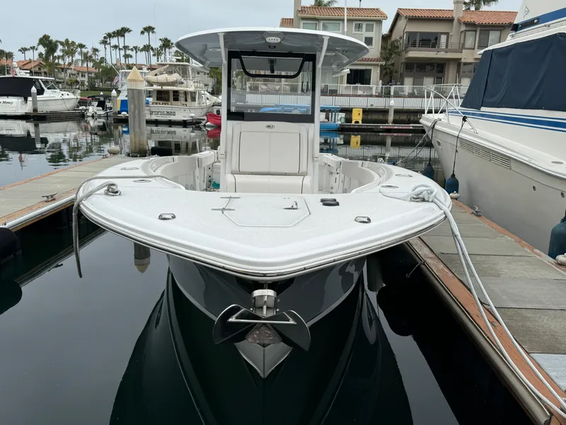 2021 Sea Hunt Gamefish 30 Coffin Box boat docked in a marina.