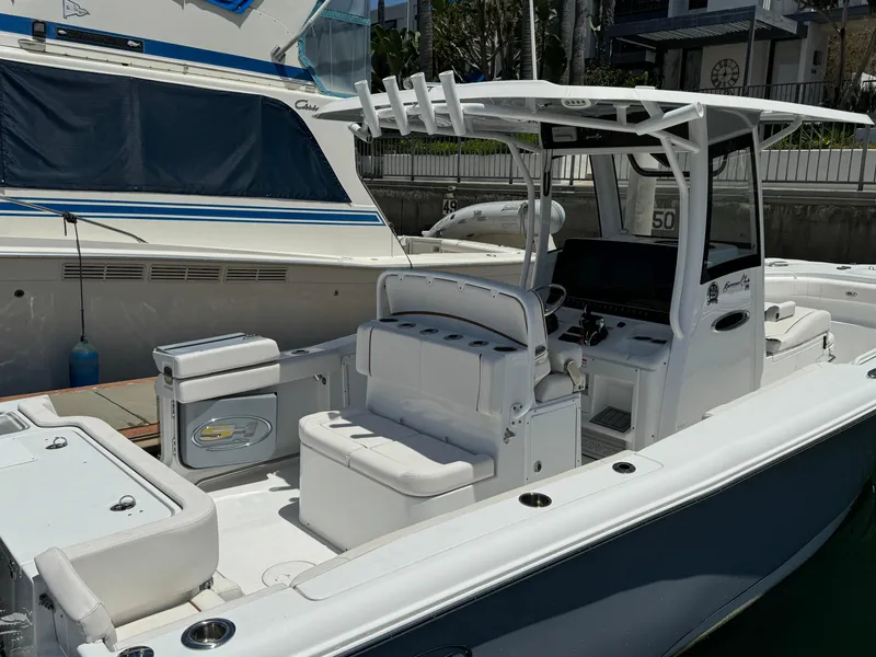 2021 Sea Hunt Gamefish 30 Coffin Box boat docked, featuring spacious seating and modern design.