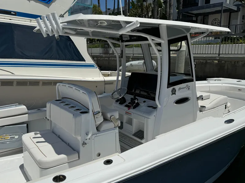 2021 Sea Hunt Gamefish 30 Coffin Box boat docked, featuring spacious seating and modern controls.