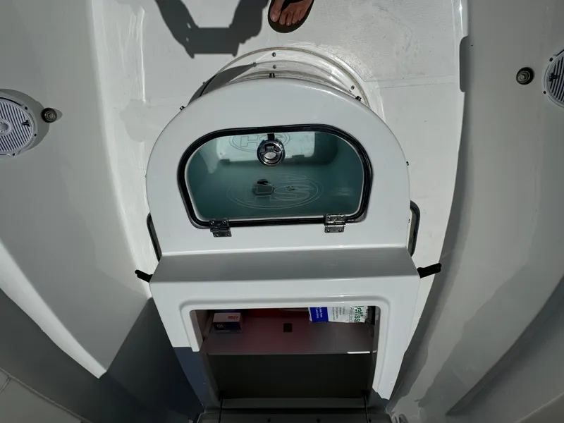 2021 Sea Hunt Gamefish 30 Coffin Box with open storage compartment and visible interior.