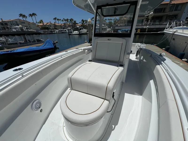 2021 Sea Hunt Gamefish 30 Coffin Box boat docked in a marina.
