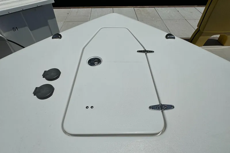2021 Sea Hunt Gamefish 30 Coffin Box deck with storage hatch and fittings.