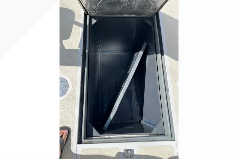 Open storage compartment on a 1971 Pacifica 44 Convertible boat deck.