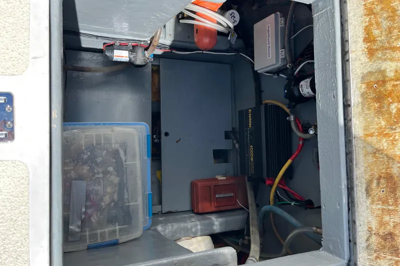 Electrical compartment of a 1971 Pacifica 44 Convertible boat, featuring wiring and equipment.
