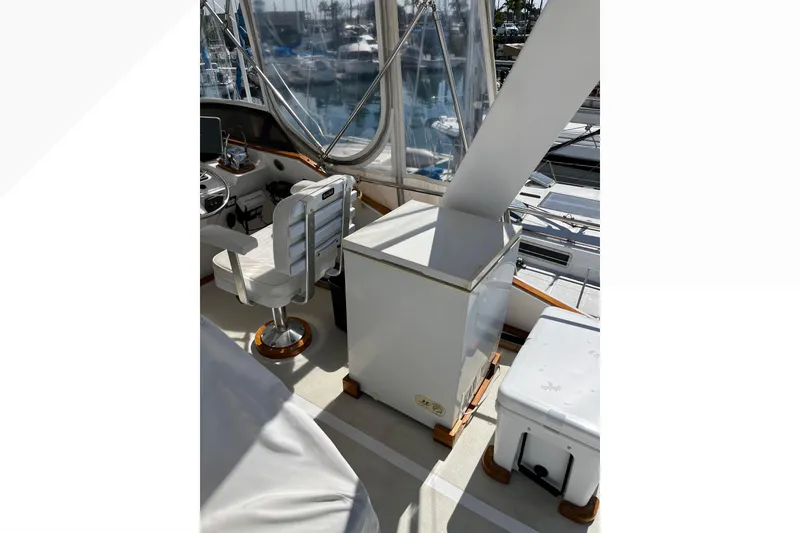 1971 Pacifica 44 Convertible yacht interior with helm station and seating.
