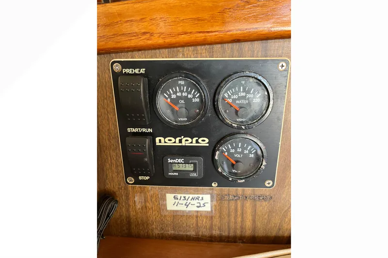 Control panel of a 1971 Pacifica 44 Convertible boat with gauges and switches.