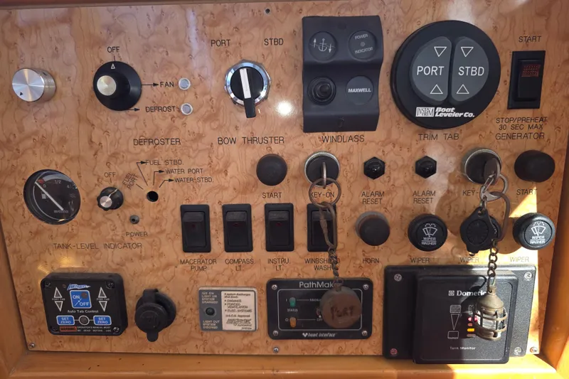 Control panel of a 2000 McKinna 48 Pilothouse with various switches and indicators.
