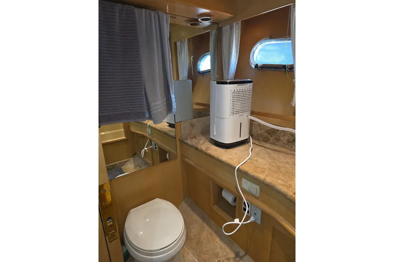 Bathroom interior of 2000 McKinna 48 Pilothouse yacht with modern amenities.