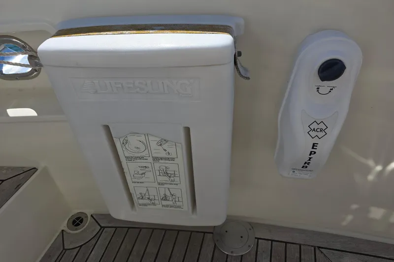 Safety equipment on a 2000 McKinna 48 Pilothouse, featuring Lifesling and ACR EPIRB.