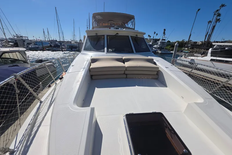 2000 McKinna 48 Pilothouse yacht docked at marina, sunny day, clear sky.