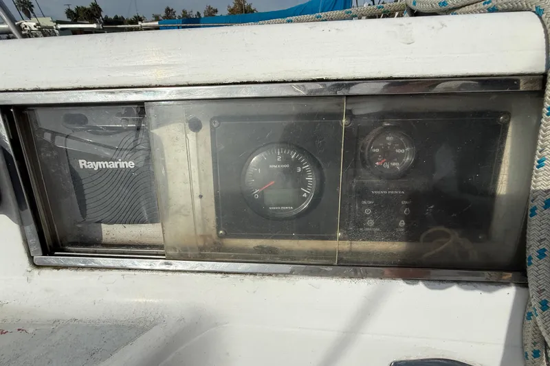 Control panel of a 1985 MacGregor 65 sailboat with Raymarine and Volvo Penta instruments.