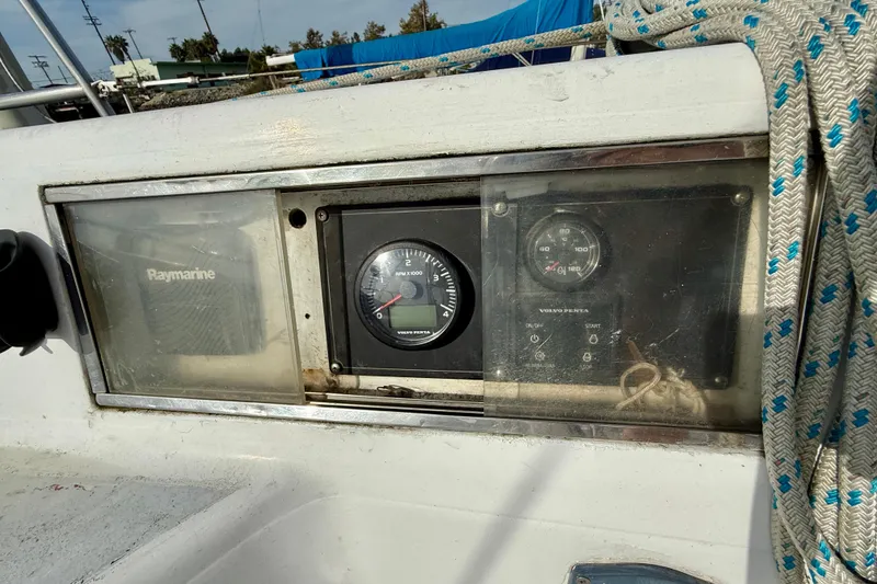 Control panel of a 1985 MacGregor 65 sailboat with Raymarine and Volvo Penta instruments.