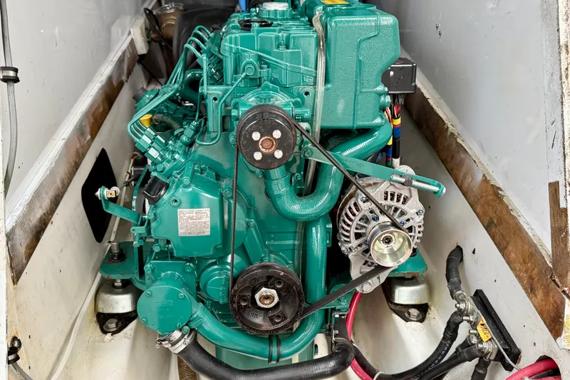 Engine of a 1985 MacGregor 65 sailboat, showcasing detailed mechanical components.