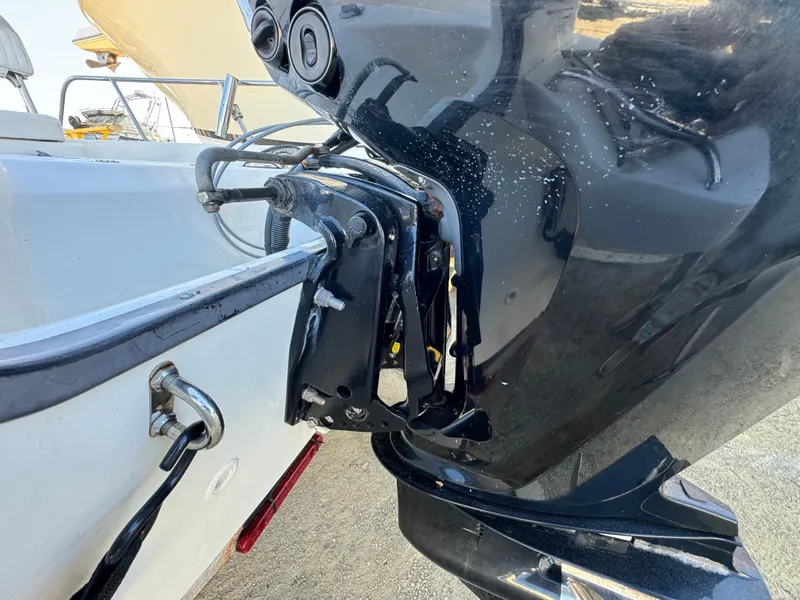 2016 Boston Whaler 170 MONTUCK boat engine close-up, showcasing motor and mounting details.