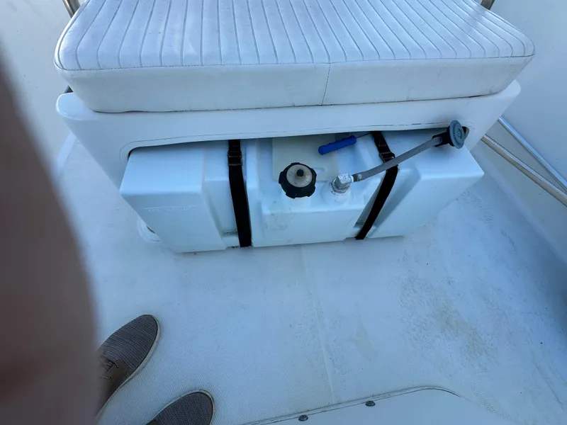 Boston Whaler 170 MONTUCK 2016 boat seat with storage compartment and fuel tank.