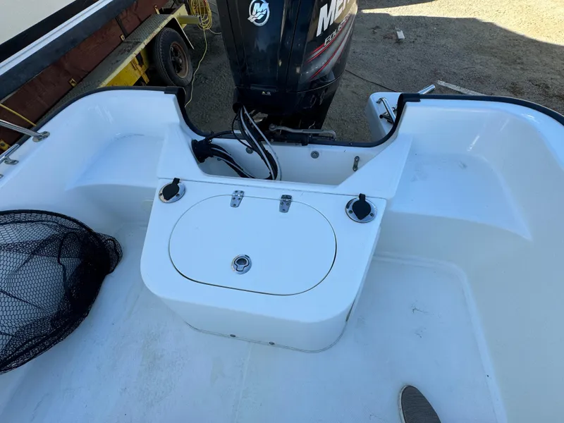 2016 Boston Whaler 170 MONTUCK boat interior with engine and storage compartments.