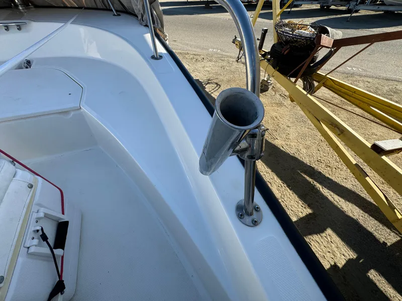 Boston Whaler 170 MONTUCK 2016 boat interior with rod holder and seating area.