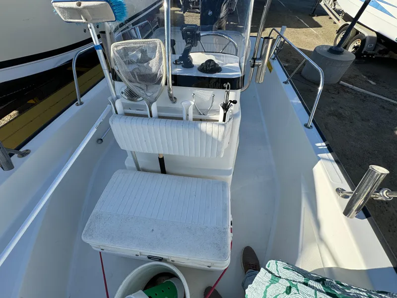 2016 Boston Whaler 170 MONTUCK boat interior with seating and console.