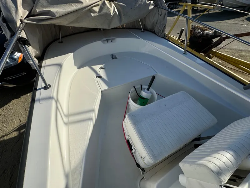 2016 Boston Whaler 170 MONTUCK boat interior with seating and cover.