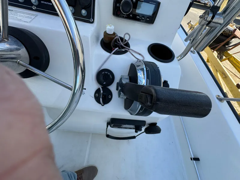 2016 Boston Whaler 170 MONTUCK boat dashboard with steering wheel and controls.