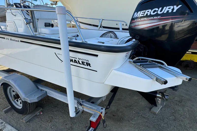 2016 Boston Whaler 170 Montauk boat with Mercury outboard engine on trailer.
