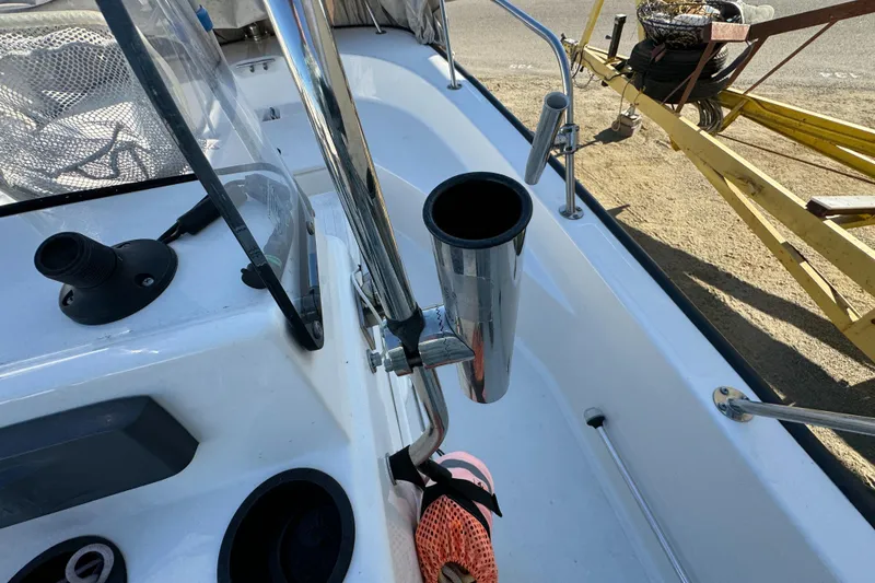 Boston Whaler 170 MONTUCK 2016 boat interior with rod holder and console details.