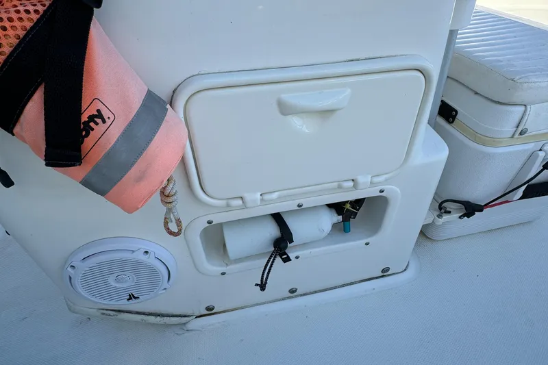 2016 Boston Whaler 170 MONTUCK boat interior with storage compartments and safety equipment.