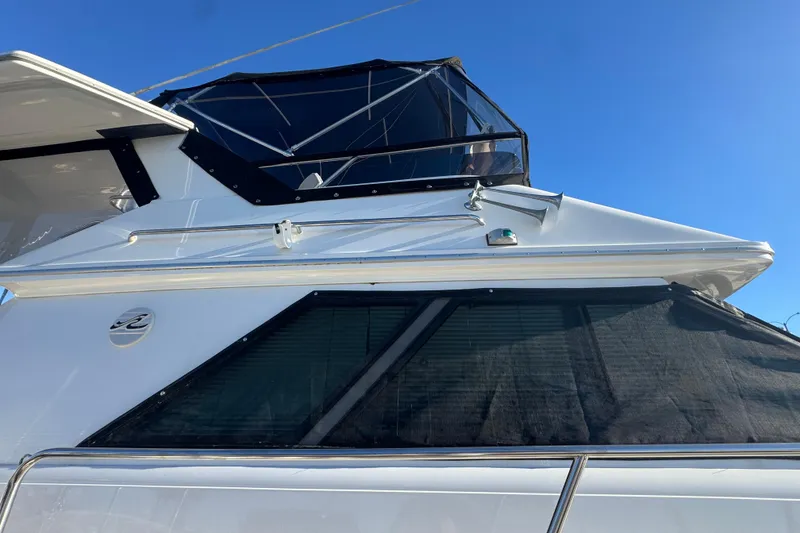 1990 Sea Ray 380 Aft Cabin yacht with sleek design and tinted windows.