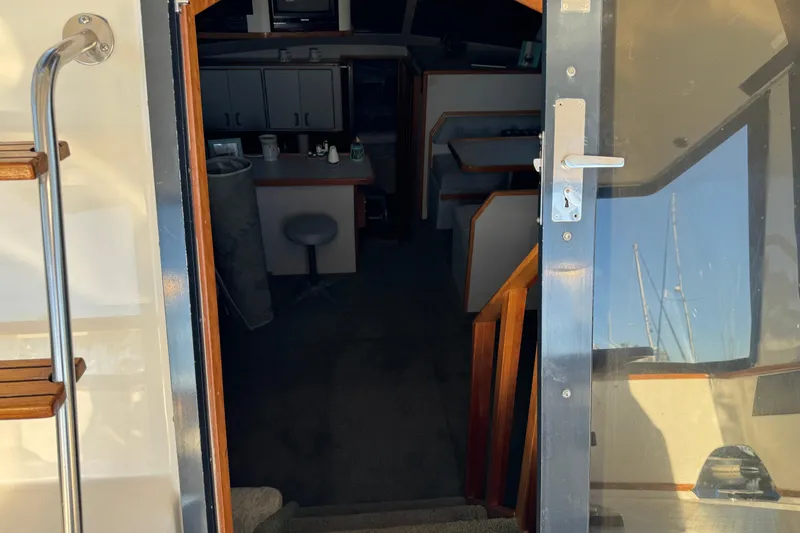Interior view of 1990 Sea Ray 380 Aft Cabin yacht, showing stairs and cabin entrance.