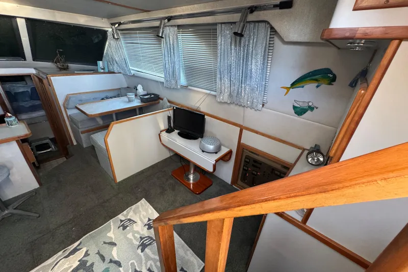 Interior of 1990 Sea Ray 380 Aft Cabin with dining area and decor.