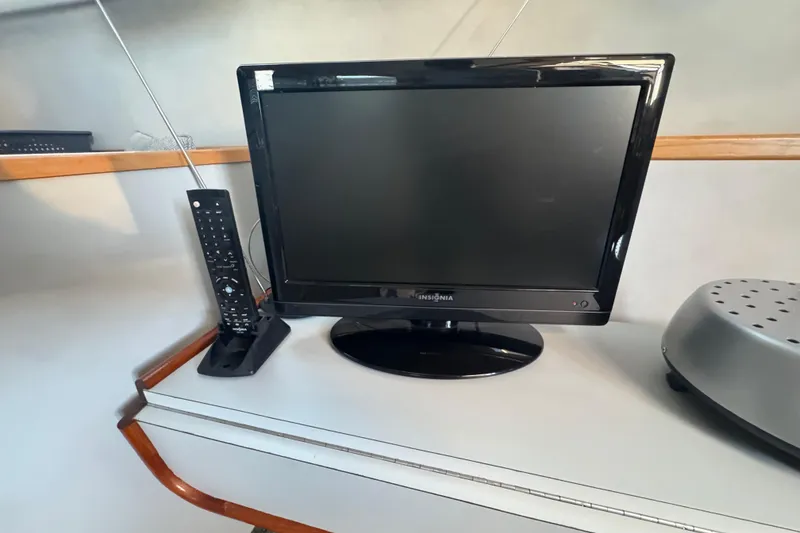TV and remote on Sea Ray 380 Aft Cabin yacht, 1990 model.