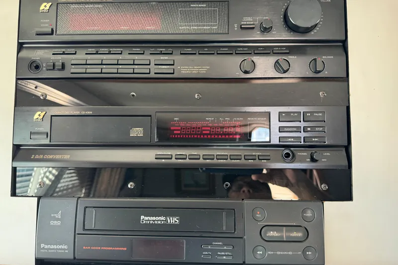 Vintage audio system with Panasonic VHS player in a 1990 Sea Ray 380 Aft Cabin.